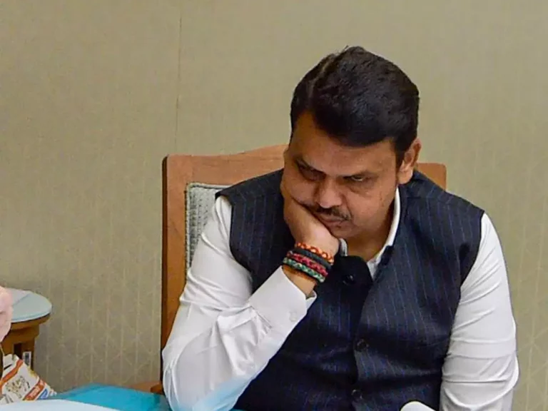 Fadnavis- raised-his- hand- to- his-head