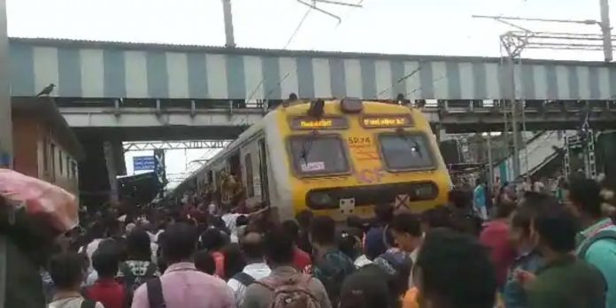 Woman climbs into motorman's cabin at Diva station, stops local train